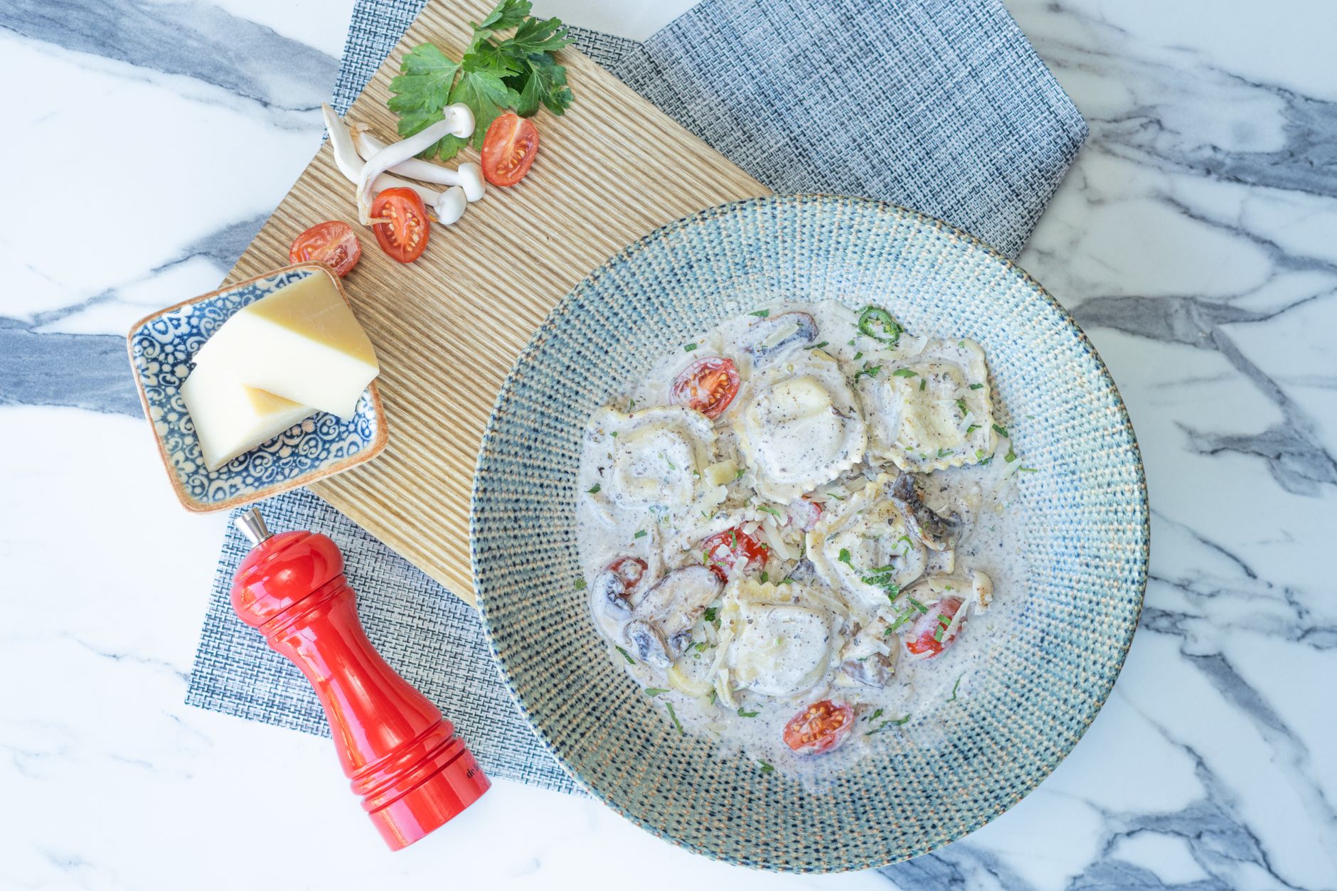 Tortellini met roomsaus en champignons