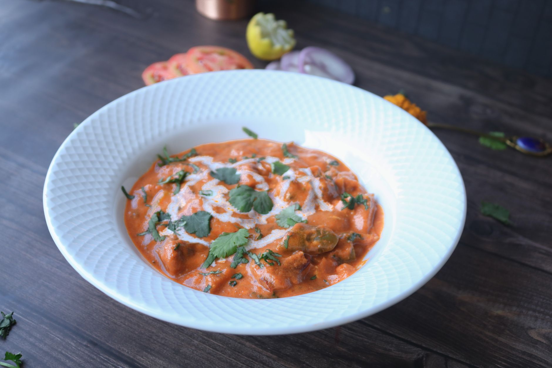 Paneer in romige tomaten-kerriesaus
